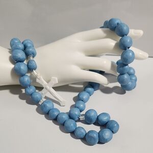 Elegant Blue Beaded Necklace with White Cross